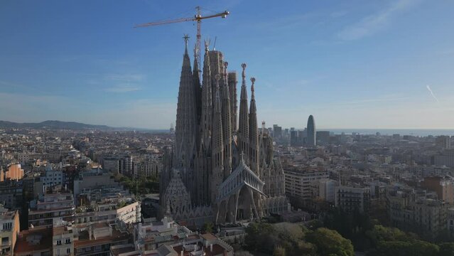 flying counter clockwise around Sagrada Familia cathedral in Barcelona Spain