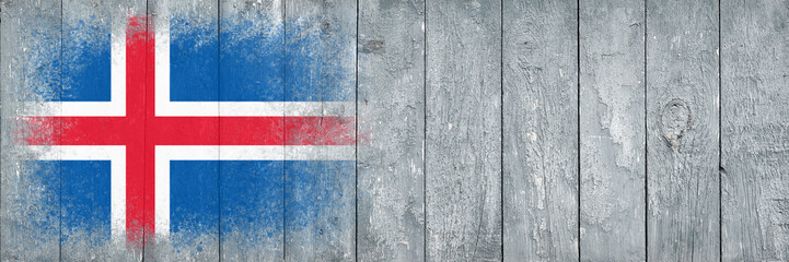 Fototapeta premium Flag of Iceland. Flag is painted on a gray wooden plank surface. Wooden background. Plywood surface. Copy space. Textured background
