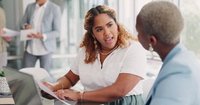 Paperwork, discussion and business women in the office analyzing company review, proposal or report. Documents, professional and female corporate employees in conversation working on project together
