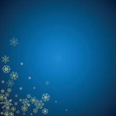 Fototapeta na wymiar New Year snow on blue background. Gold glitter snowflakes. Christmas and New Year snow falling backdrop. For season sales, special offers, banners, cards, party invites, flyers. Frosty winter on blue.