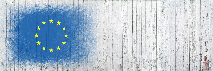 Flag of European Union. Flag is painted on a white wooden surface. Wooden background. Plywood surface. Copy space. Textured background