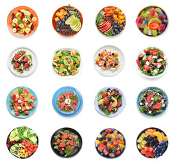 Set of plates with healthy salads on white background