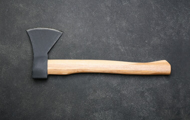 Ax on dark background, top view