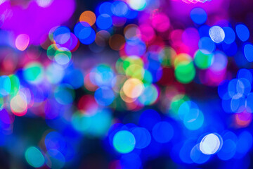 Blurred colorful lights of the christmas shop window.
