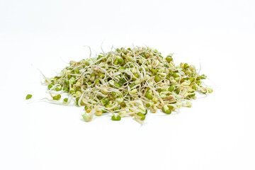 Mound of sprouted mung beans  (Vigna radiata) with small roots ofor eating. White background. Close up.