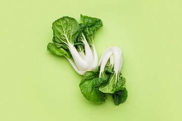 Fresh pak choi cabbage on green background - obrazy, fototapety, plakaty