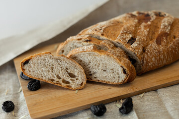 white bread lying on the board, photo in the style of rustic,sliced bread on a beige background, a place for text