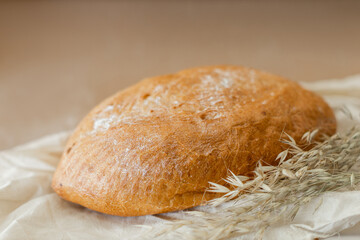 white bread lying on the board, photo in the style of rustic, on a beige background, a place for text