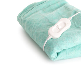 Green electric heating pad with controller on white background, closeup