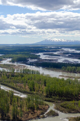 Sleeping Lady mountain from the northeast with river running in foreground