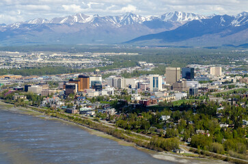 Downtown Anchorage, Alaska with Chugach mountains in the background.