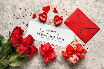 Card with text HAPPY VALENTINE'S DAY, gifts, roses and envelope on grunge background