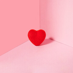 Heart in a corner on pastel light pink background. Modern Valentine's Day concept. Creative love...