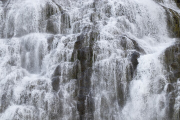 Fototapeta na wymiar Dynjandi Waterfall Water Texture, Beautiful Pure Nature in Iceland, Powerful Mountain River Background