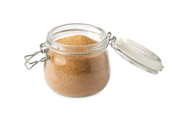 Glass jar of granulated brown sugar isolated on white