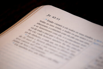 Holy Bible open to one of the pages of the book of Job