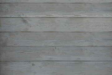 Texture of grey wooden board on black background, top view