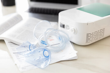 nebulizer on the table in a bright office, treatment of asthma and bronchitis.close up