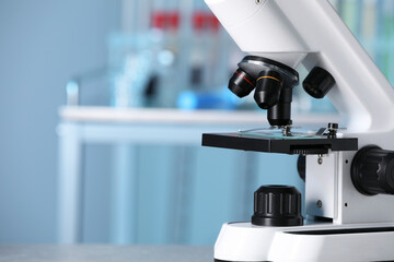 Modern medical microscope in laboratory, closeup. Space for text