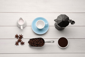 Flat lay composition with geyser coffee maker and roasted beans on white wooden background - Powered by Adobe