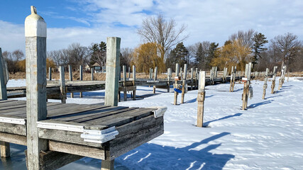 piers in frozen lake harbor