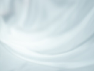 Beautiful white waves and soft shadows, elegant, silky and blurry. Fabric texture of silk, modern graceful curves and ripple pattern movement. Soft abstract style background.