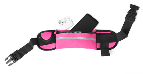 Stylish pink waist bag with smartphone and earphones on white background, top view