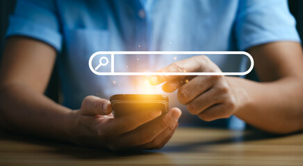 Businessman hand using mobile and laptop or computer to search information on internet social media...