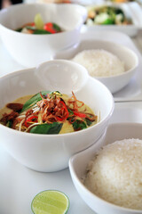 portion of vegetarian curry, basil leaf, bean sprout, fried shallot in the bowl