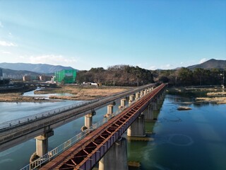 Rail Road on sunny day with Mountain and river background, Gyeongju, South Korea