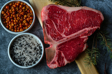Thick Raw T-Bone or porterhouse Steak with Seasoning