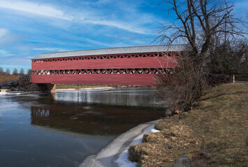 Sachs Covered Bridge over ice covered river.