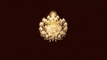 Obraz na płótnie Canvas Isolated view of crystal lamp with light bulbs illuminated