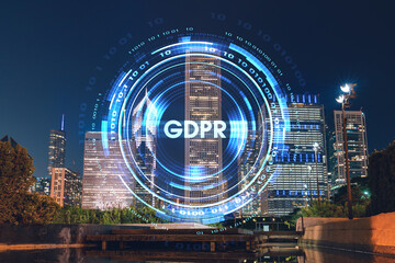 Chicago downtown area city view and Millennium Park area, night time, Illinois, USA. Skyscrapers of financial district. GDPR hologram, concept of data protection regulation and privacy for individuals