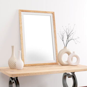 Single portrait wood picture, photo frame png mockup on wooden table with iron heart feet and ceramic beige donut and swirl vases
