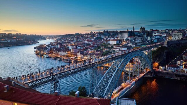 Porto day to night timelapse showing the famous landmark Dom Luís I Bridge. Portugal