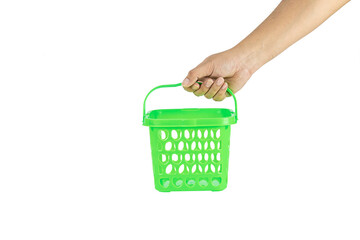Fototapeta premium Hand holding green shopping basket isolated on white background with clipping path