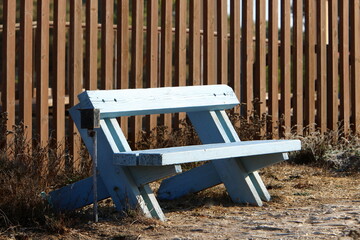 Bench for rest in the city park on the seashore.