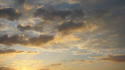 Naklejka na ściany i meble Clouds Golden sky after sunset Beautiful sky after the sun.
