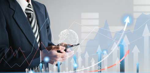 Businessman analyzing business plan growth and growth of positive indicators in business. Digital charts on a virtual interface. Business planning concept.