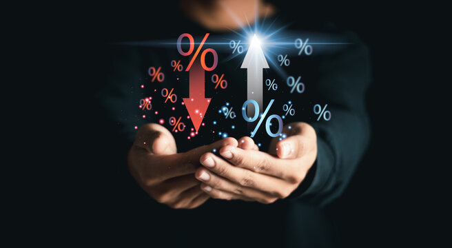 Businessman showing percentage icons and up and down arrow icons with graph indicators. Concept of financial interest rates and mortgage rates. Interest Rates Stocks Finance Ratings Mortgage Rates.
