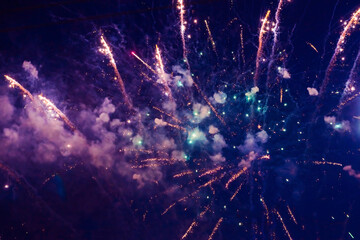 Fototapeta na wymiar Bright, beautiful purple fireworks in the night sky.