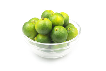 Lime fruits in glass bowl isolated on white background.	