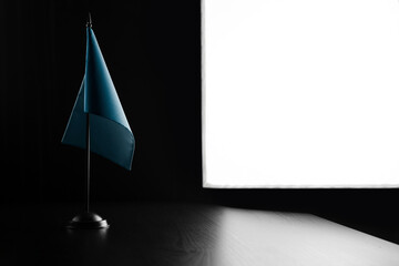 Small national flag of the Palau on a black background