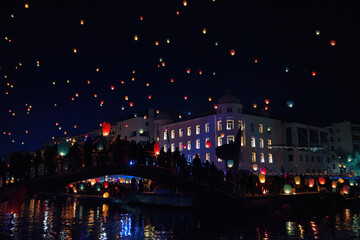 Fototapeta na wymiar Many lanterns floating in the sky during the Volos Lantern Festival, Greece