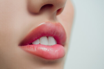 Sensual lips. Woman mouth with white teeth. White teeth, dental background. Tender lips. Close-up perfect natural lip.