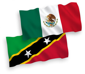 National vector fabric wave flags of Mexico and Federation of Saint Christopher and Nevis isolated on white background. 1 to 2 proportion.