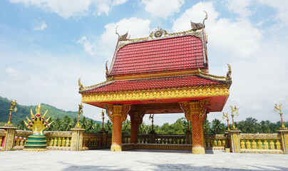 A Beautiful Temple Pavilion Outdoor Glod, Red at Wat Ban Ngao Temple (Wat Baan Ngaw), Ranong Province, Thailand.