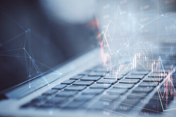 Close up of notebook with falling red index candlestick graph on screen. Blurry background. Crisis, market fall, recession and money loss concept. Double exposure.