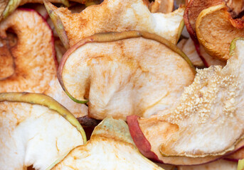 Dried apples as background. Close-up